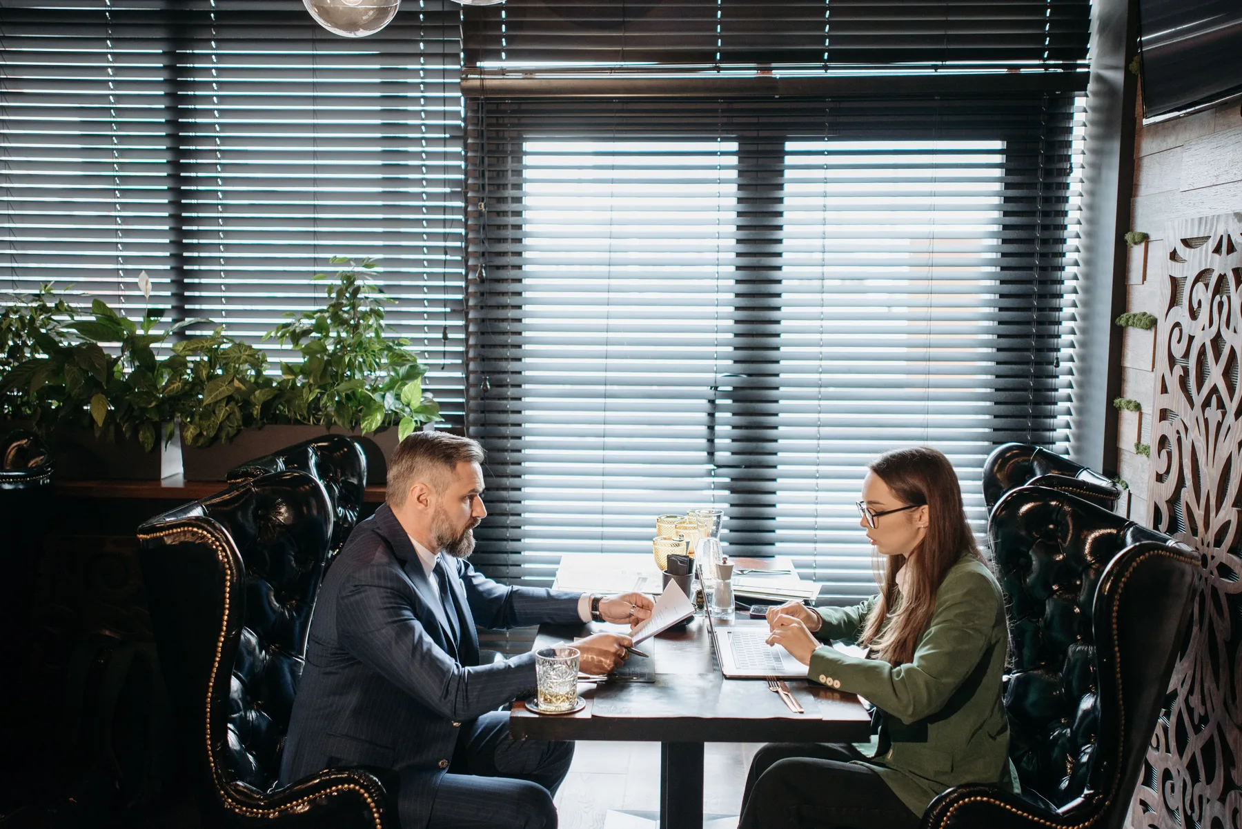 Hospitality leaders discussing strategy together in a restaurant